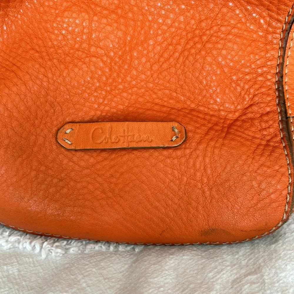 Large leather Cole Haan orange shoulder bag with silver hardware buckles. - Picture 13 of 16